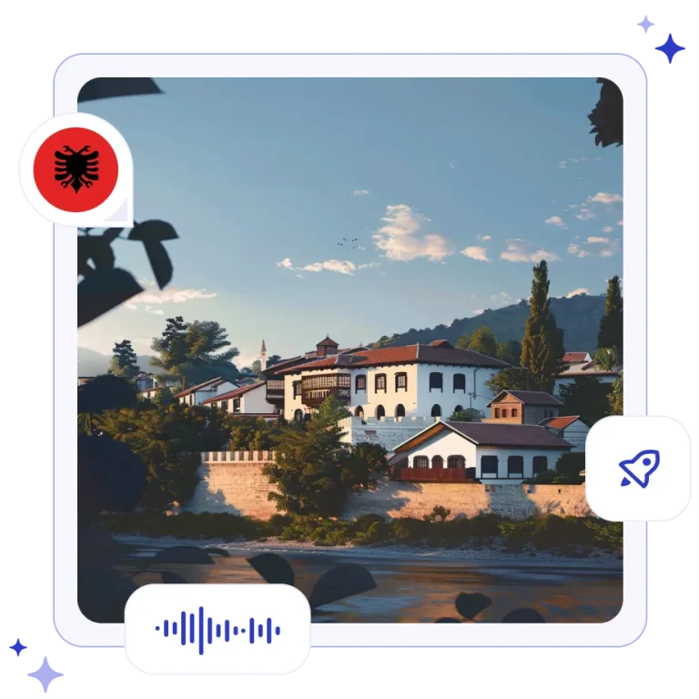 White Ottoman-style stone houses with dark wooden windows stacked up a hillside overlooking the river in Berat, Albania.